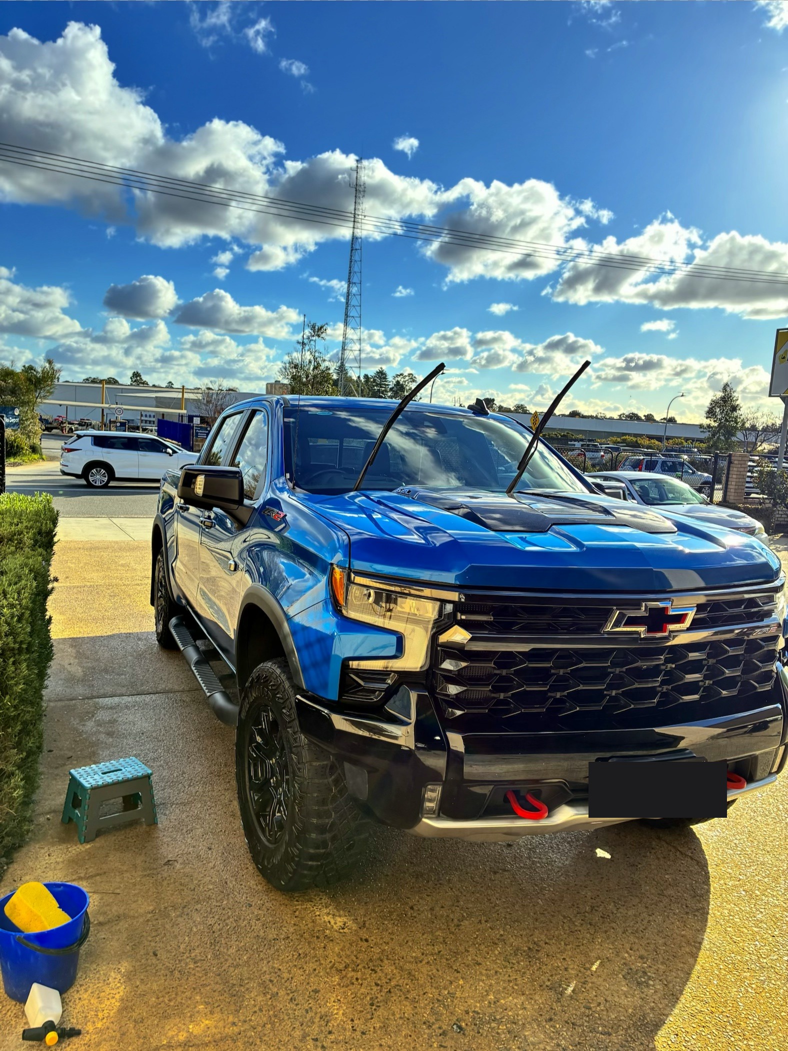 Freshly detailed glossy blue Chevrolet Silverado pickup truck